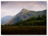Mountain ridge rising above dark moorland